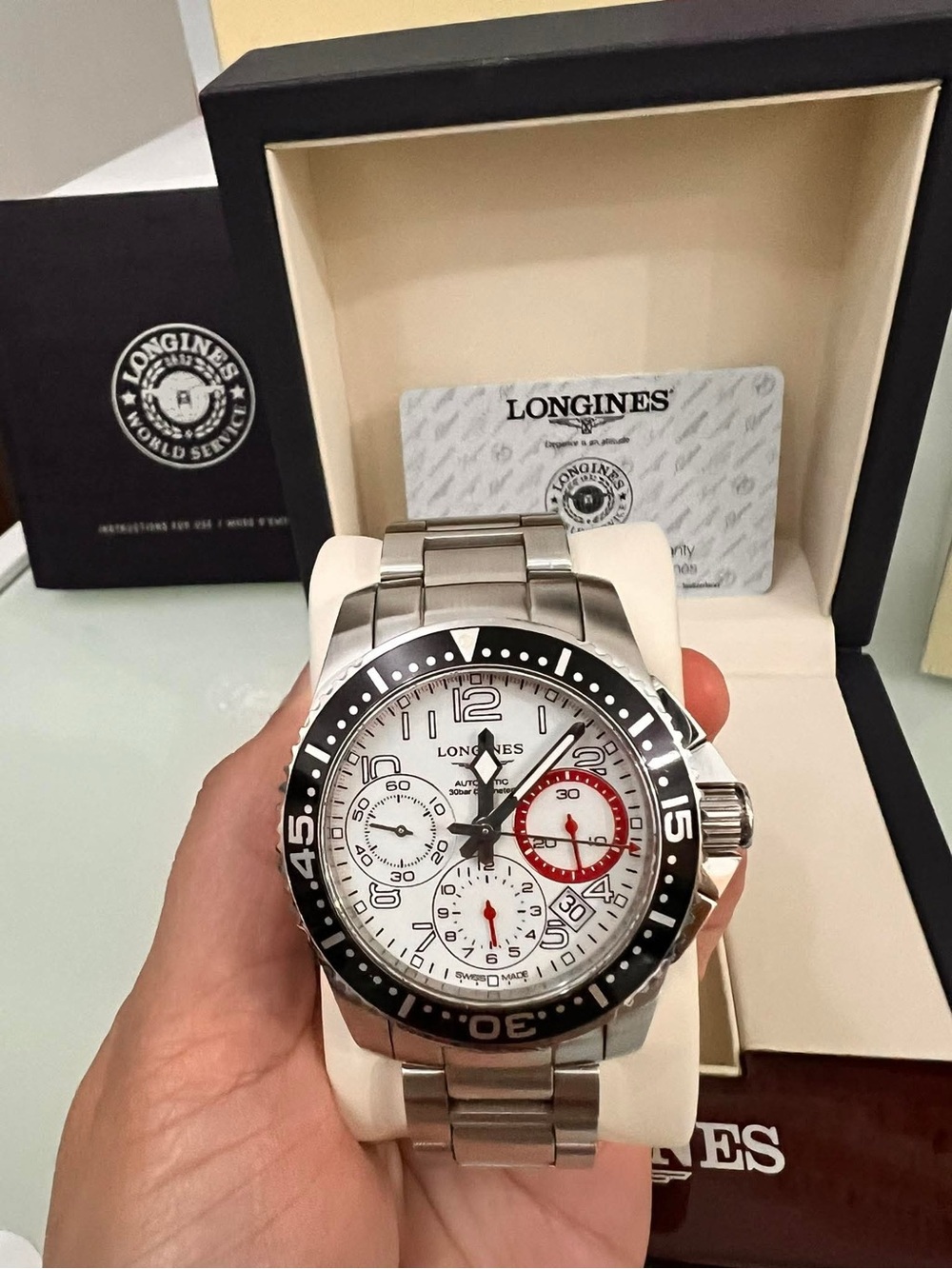 Longines Silver Steel Chronograph Watch with White Dial and Black Bezel